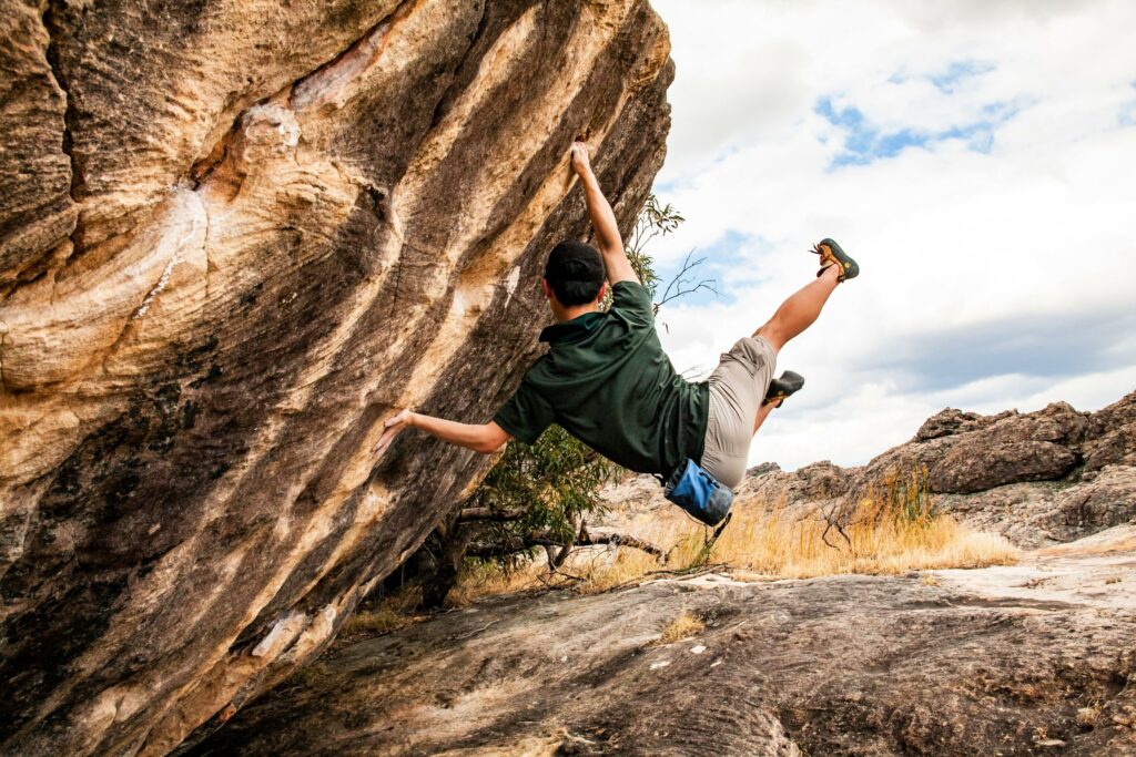 Person climbing on sandstone rocks 